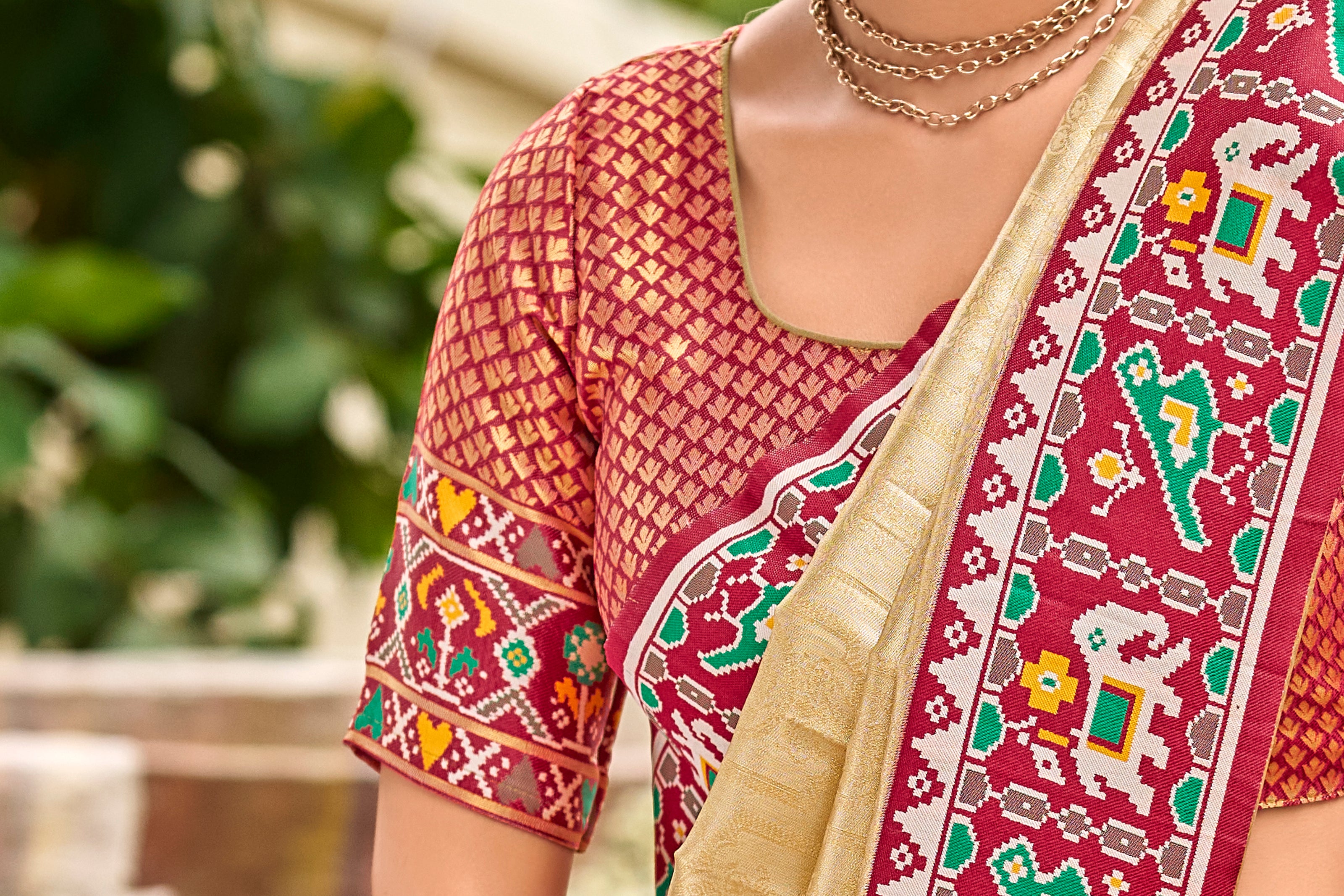 Cream Golden Patola Tissue Saree with Maroon Multicolour Border