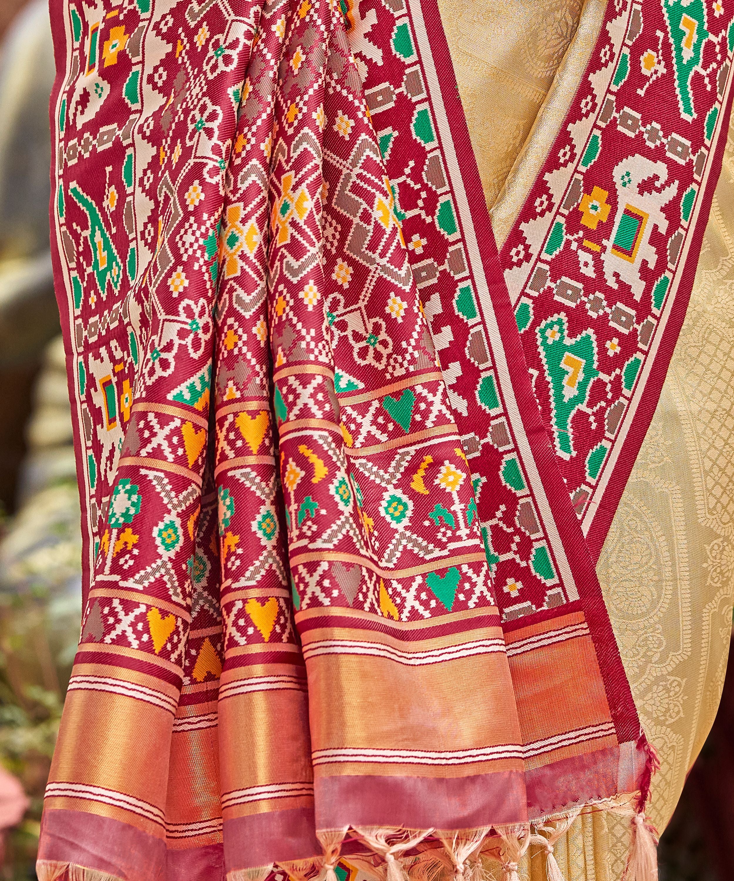 Cream Golden Patola Tissue Saree with Maroon Multicolour Border