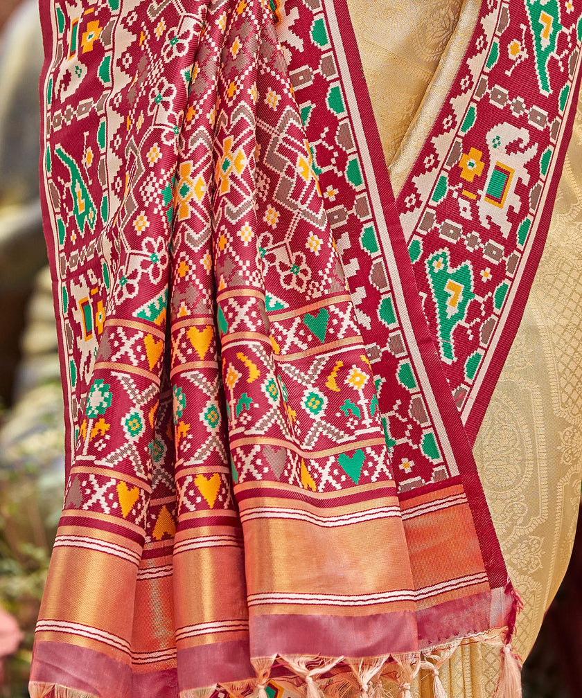 Cream Golden Patola Tissue Saree with Maroon Multicolour Border