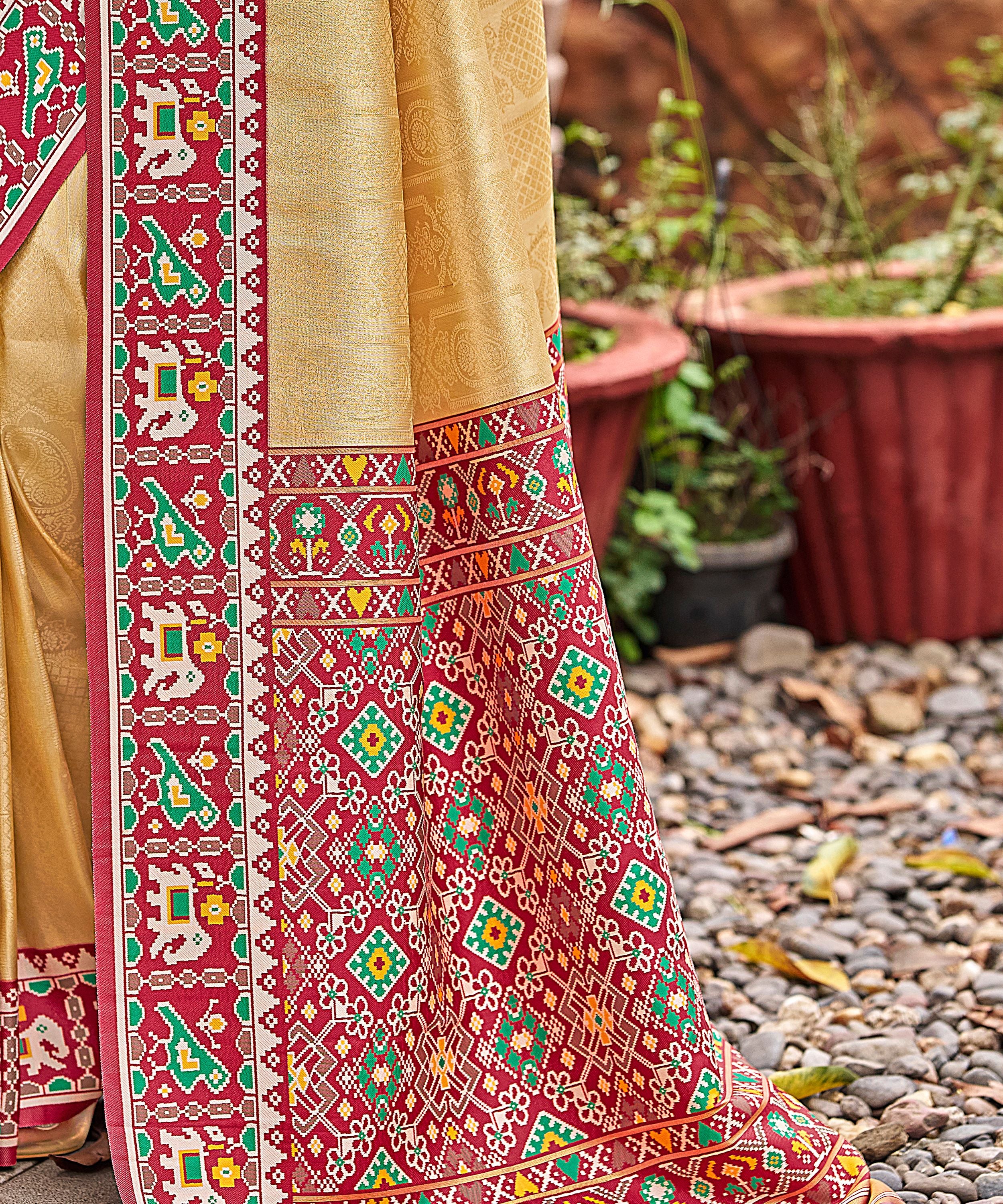Cream Golden Patola Tissue Saree with Maroon Multicolour Border
